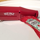 Heinz Packet Roller on a plate with a packet of ketchup ready to dispense